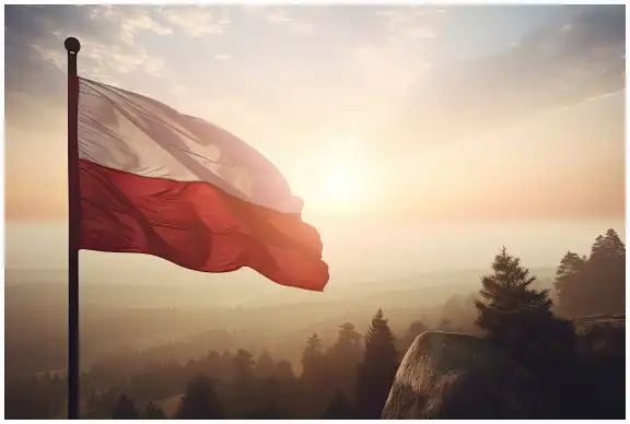 Polish flag waving in the wind in the hills.