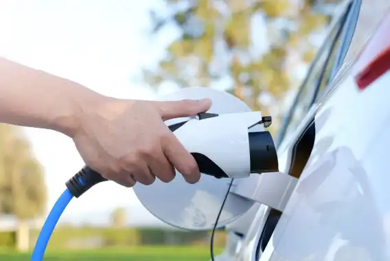 2020 Completion of the TEN T Project Man charging an electric car.